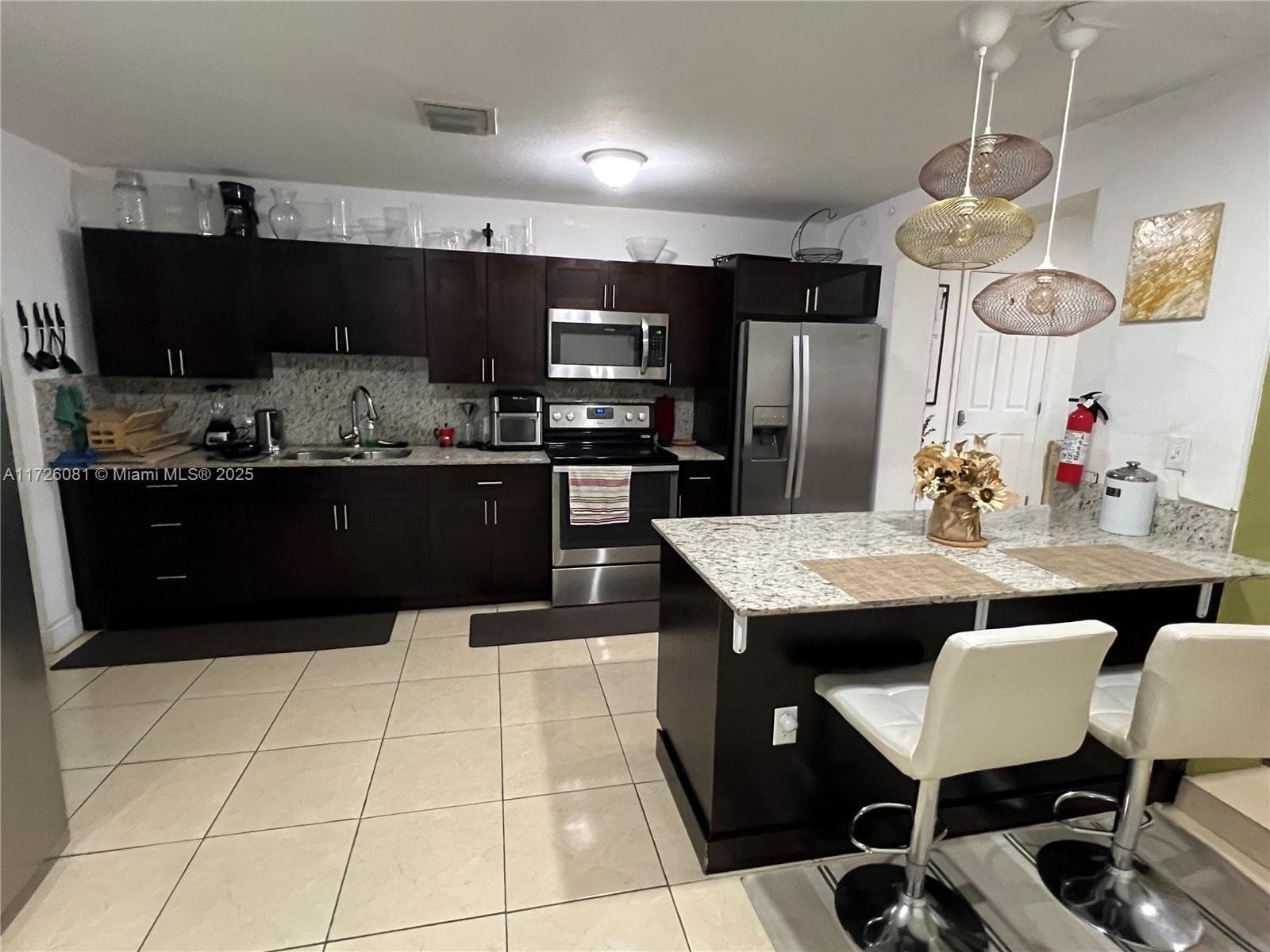 720 NW 30th Ave, Miami FL 33125 — 16