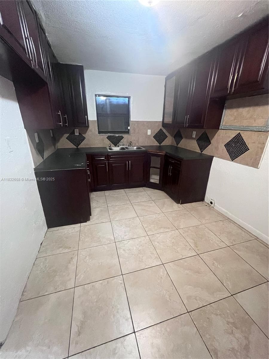 1927 NW 64 st, Miami FL 33147 — 5