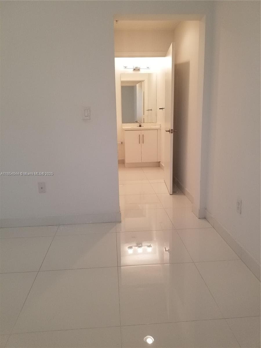 2651 NE 212th Ter # 103, Miami FL 33180 — 18