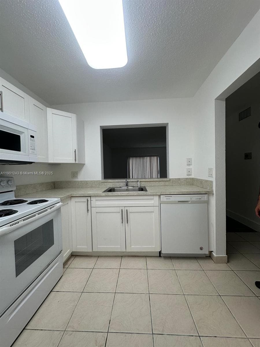 18101 NW 68th Ave # E210, Hialeah FL 33015 — 3