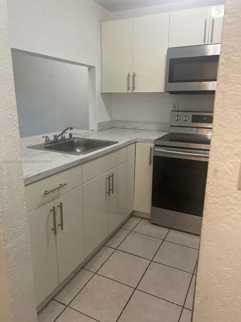 4550 NW 9th St # 114E, Miami FL 33126 — 2