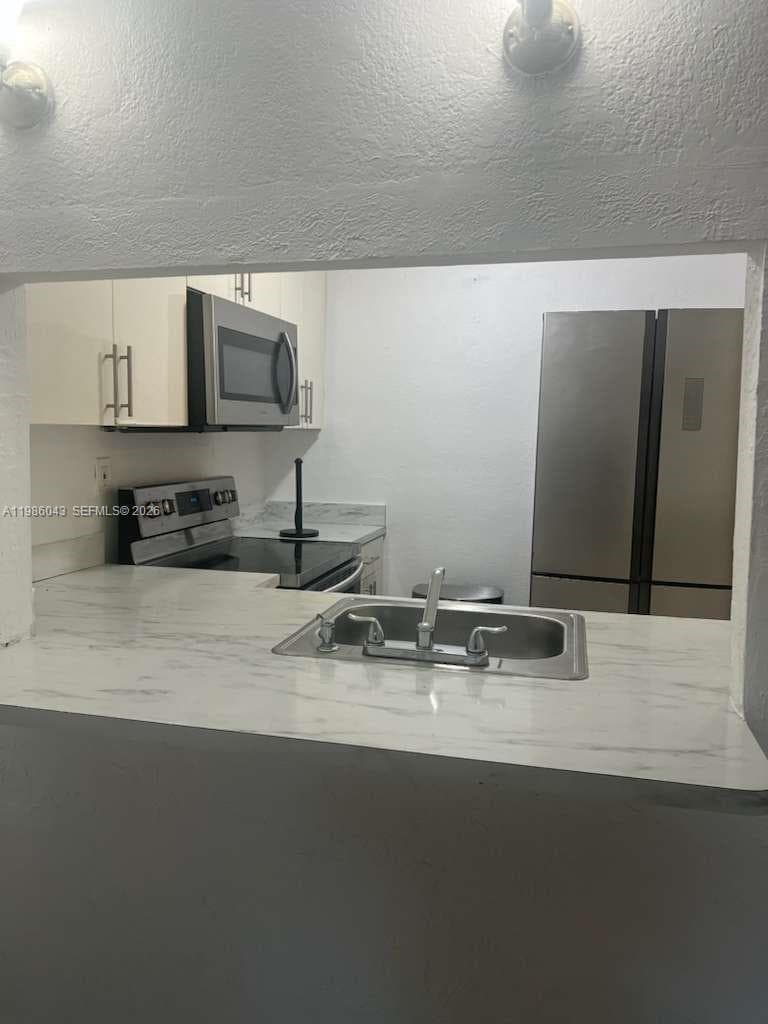 4550 NW 9th St # 114E, Miami FL 33126 — 1