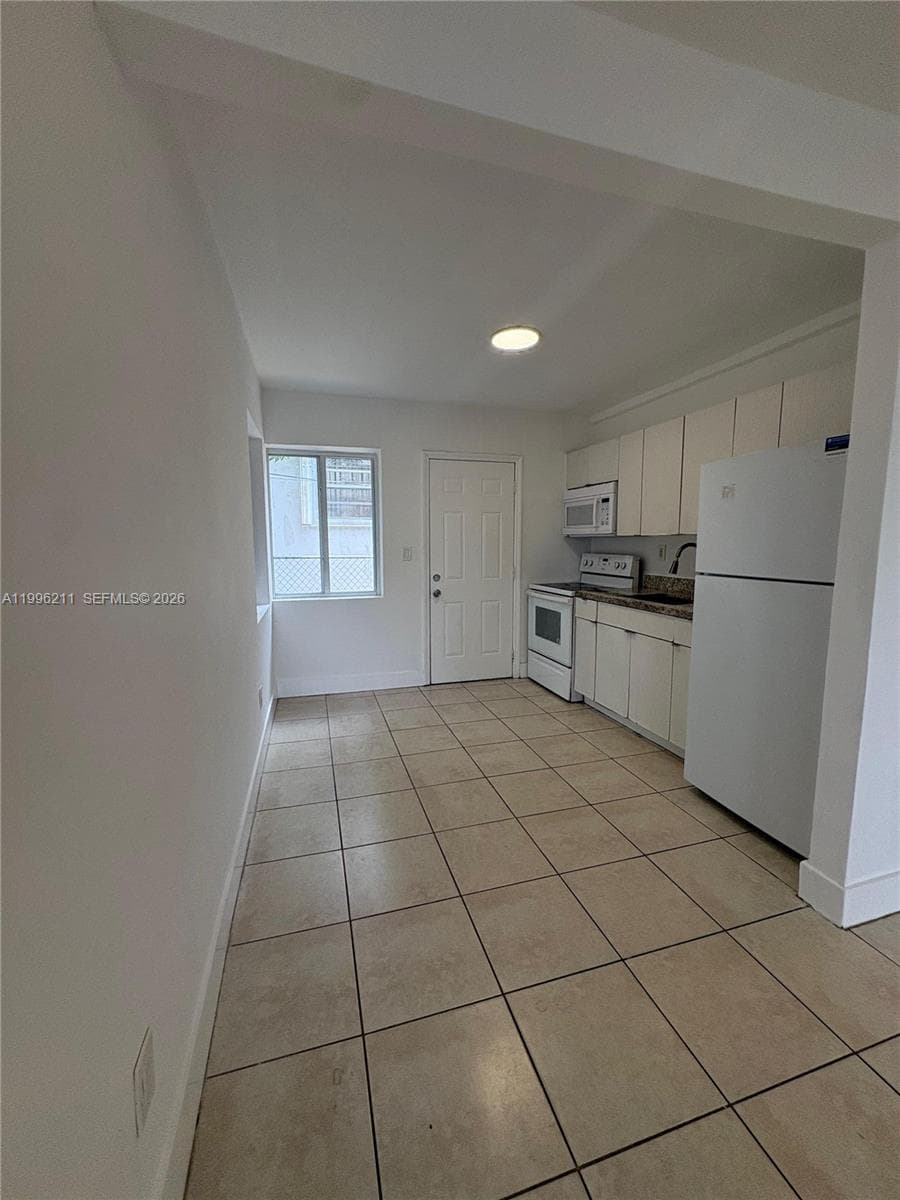 1128 NW 76th St, Miami FL 33150 — 9