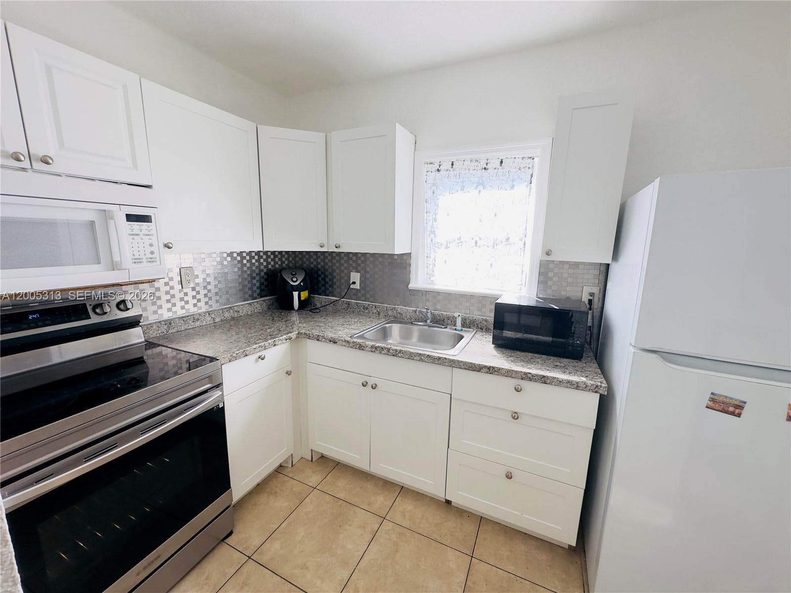 301 NW 37th St, Miami FL 33127 — 3