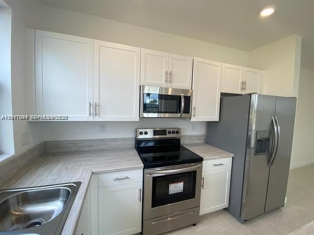 575 NE 208th Ter # 575, Miami FL 33179 — 18