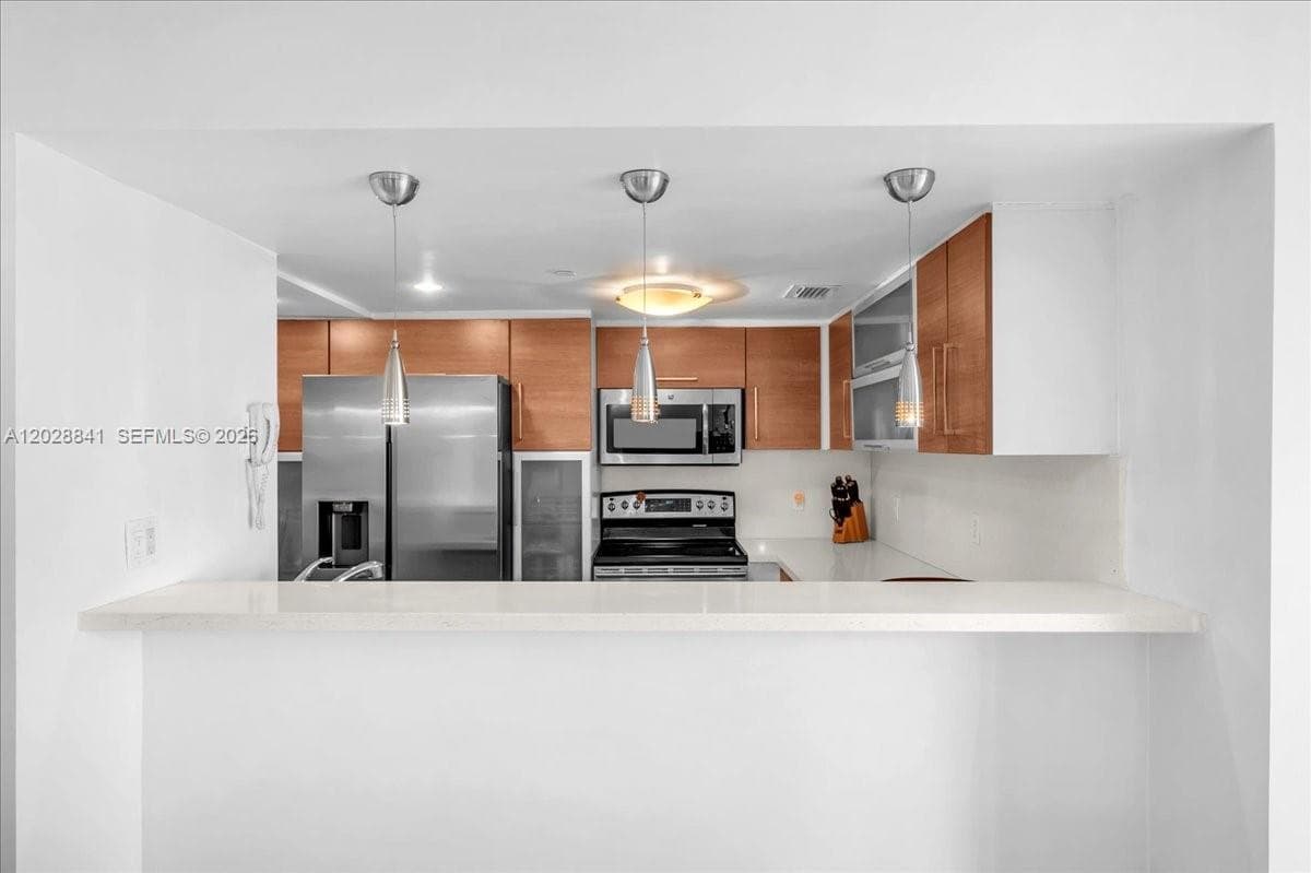 2000 Towerside Ter # 908, Miami FL 33138 — 9