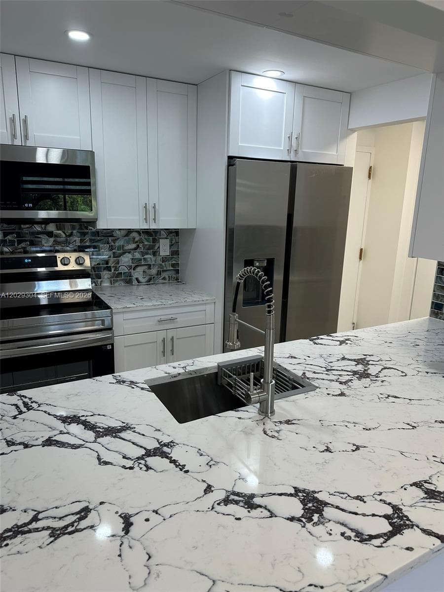 5280 NW 7th St # 306, Miami FL 33126 — 1